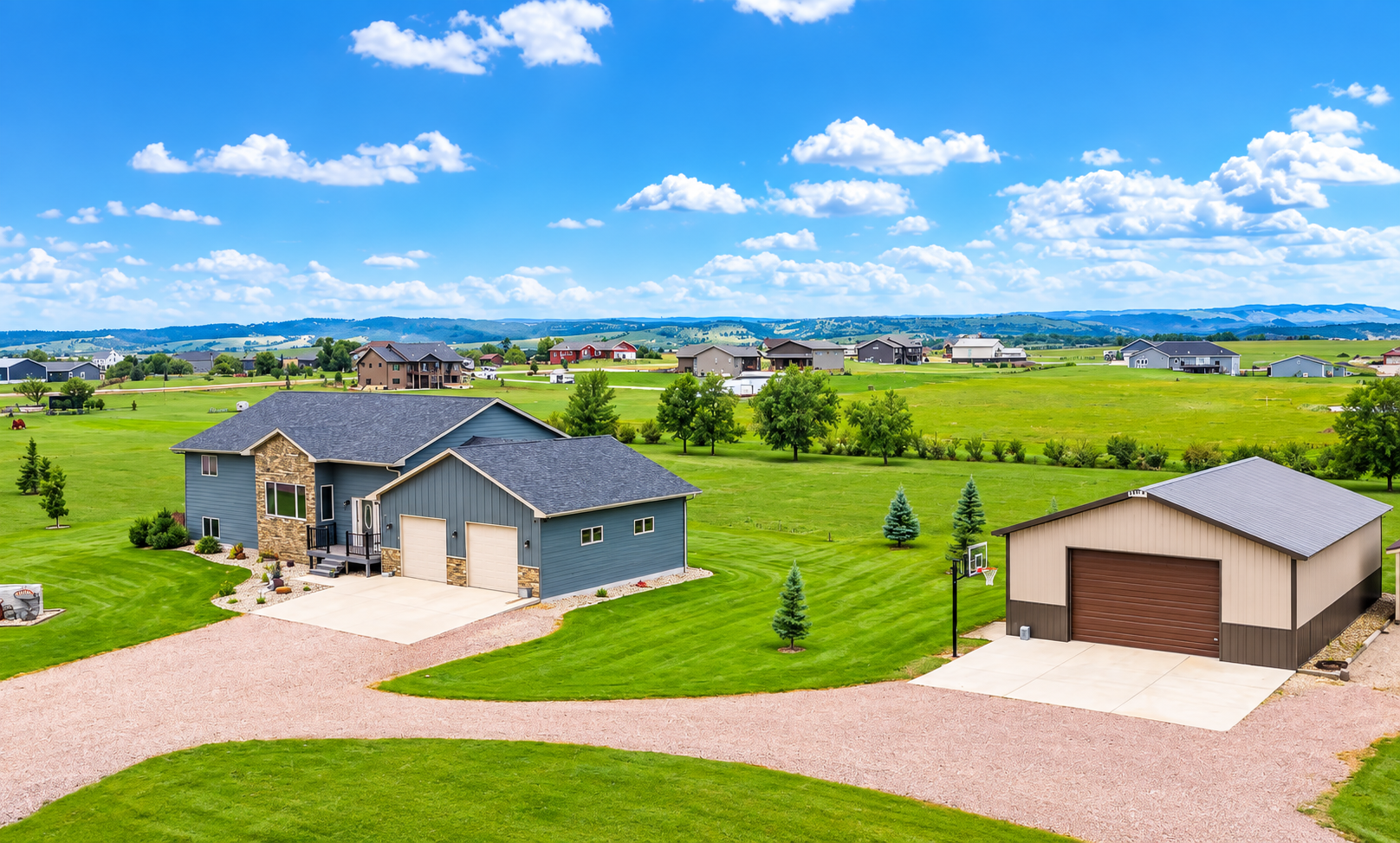 Aerial view showing the home, shop and surrounding Black Hills landscape